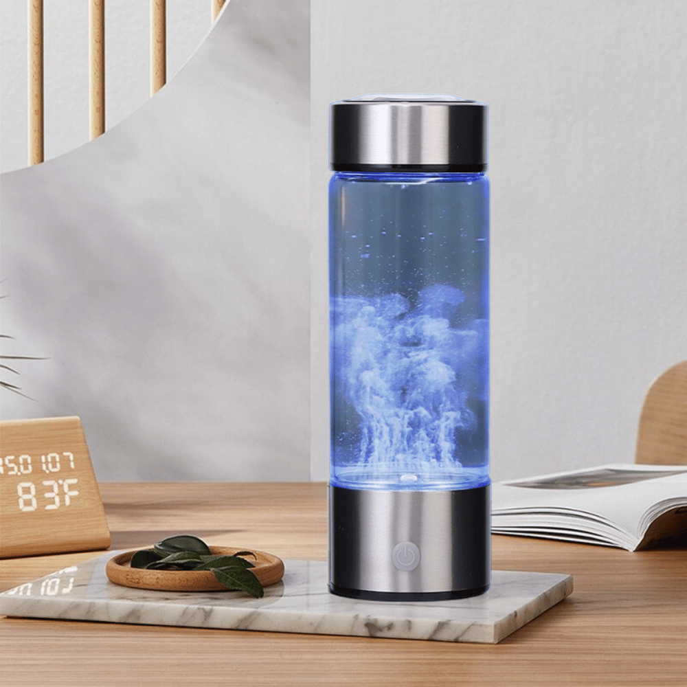 Hydrogen water bottle lying on a desk, highlighting modern stainless steel base and glass build