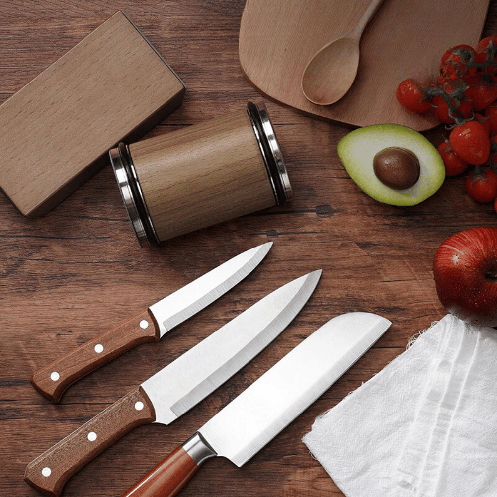 Knife sharpener with multiple knives on cutting board, perfect for chef tools.