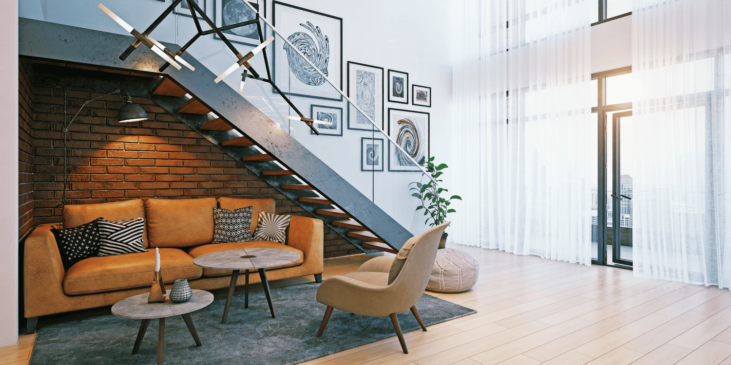 Modern living room with industrial staircase, stylish furniture, and natural light, showcasing a cozy and functional home interior.