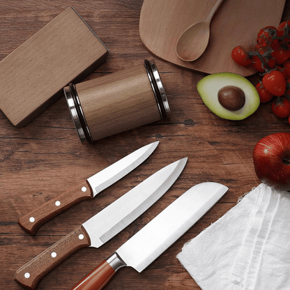 Knife sharpener with multiple knives on cutting board, perfect for chef tools.