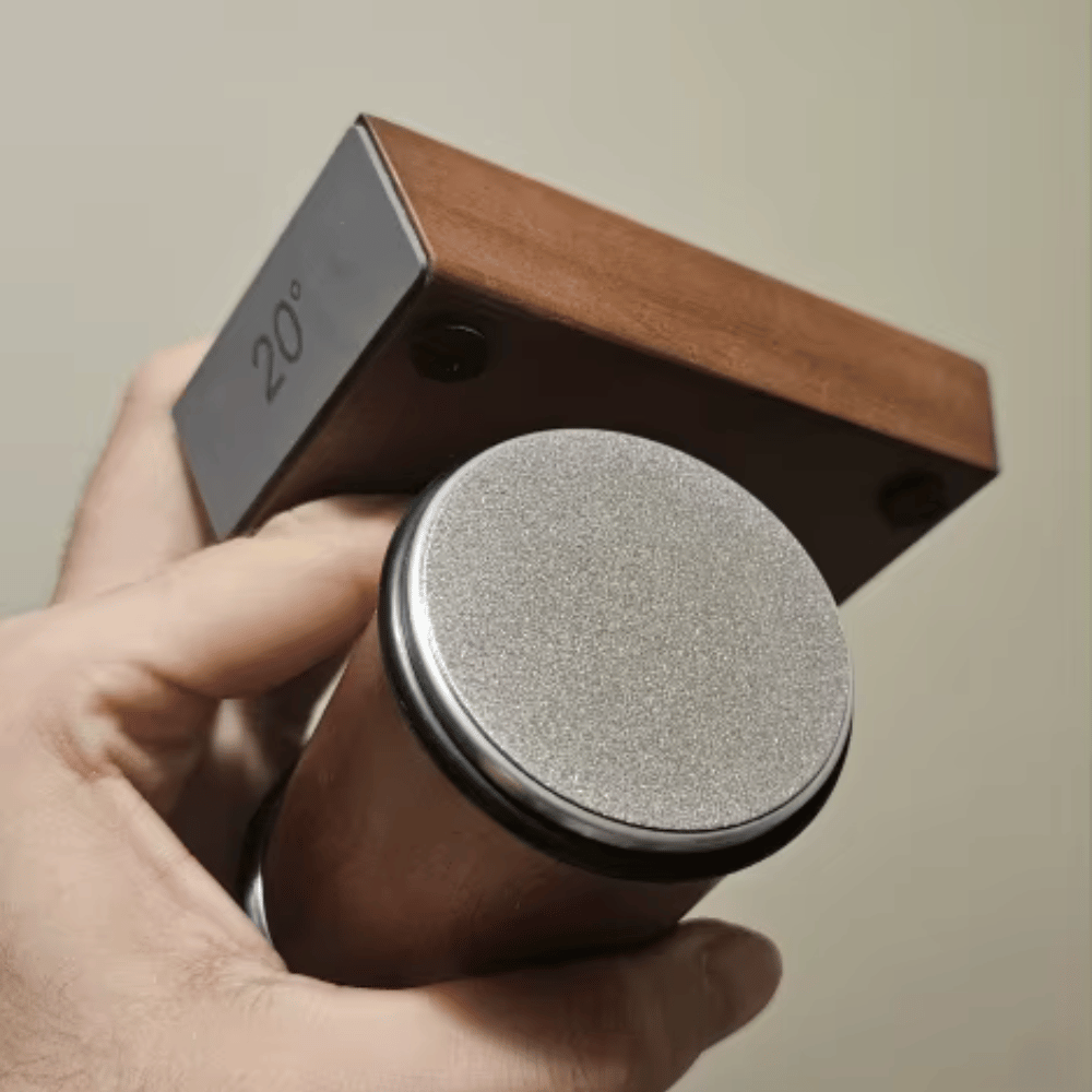 Close-up of Magnetic Rolling Knife Sharpener in use, sharpening a kitchen knife with precision.